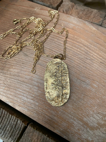 brass tall timber necklace